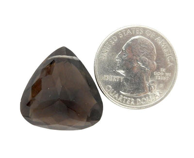 one smoey quartz bead with quarter for size reference