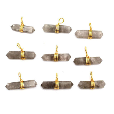nine smokey quartz gold wire wrapped pendants in rows of three on white background for possible variations