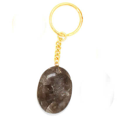 close up of one smokey quartz worry stone keychain for details