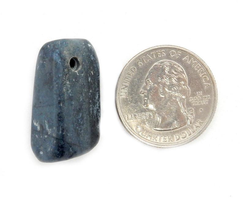 Drilled Tumbled Stone Sodalite Beads Next to a Quarter on White Background.