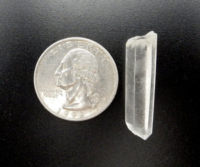 Single Crystal Points Laser Points from Brazil next to quarter for size comparison