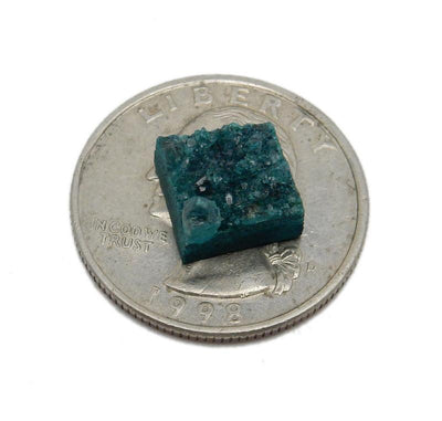 a Teal Green Square Druzy piece on top of a quarter for sizing 