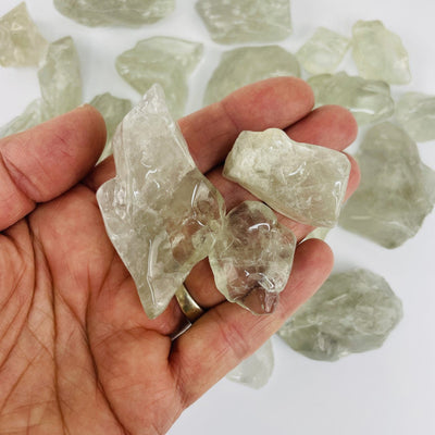 Prasiolite Polished Pieces some in a hand showing size variation