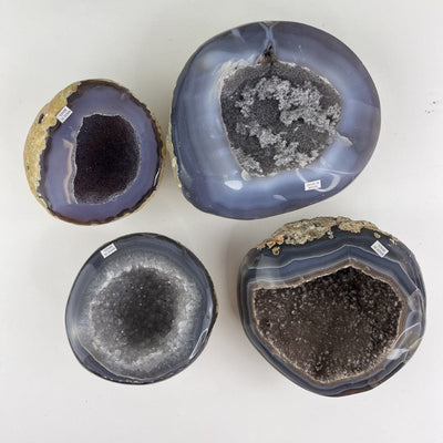 Bulk Lot 4 Polished Geode Halves on table