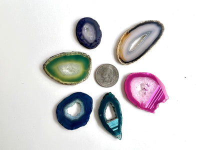 Mix Druzy Agate Slices to show color verity and sizes next to a quarter
