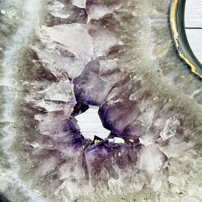 Amethyst Slice in shape of 8 on Metal Stand up close of crystals