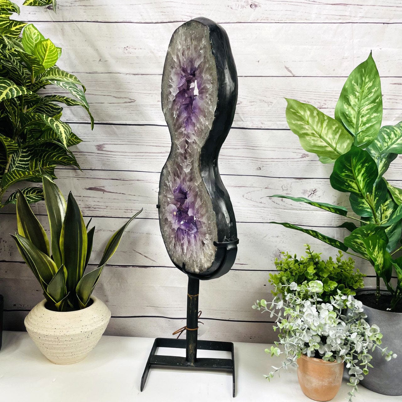 Amethyst Slice in shape of 8 on Metal Stand side view