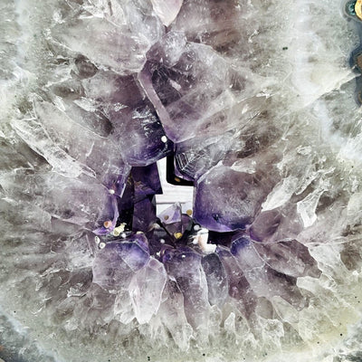 Amethyst Slice in shape of 8 on Metal Stand up close of crystals