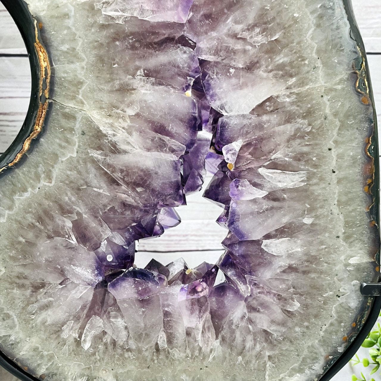 Amethyst Slice in shape of 8 on Metal Stand up close of crystals