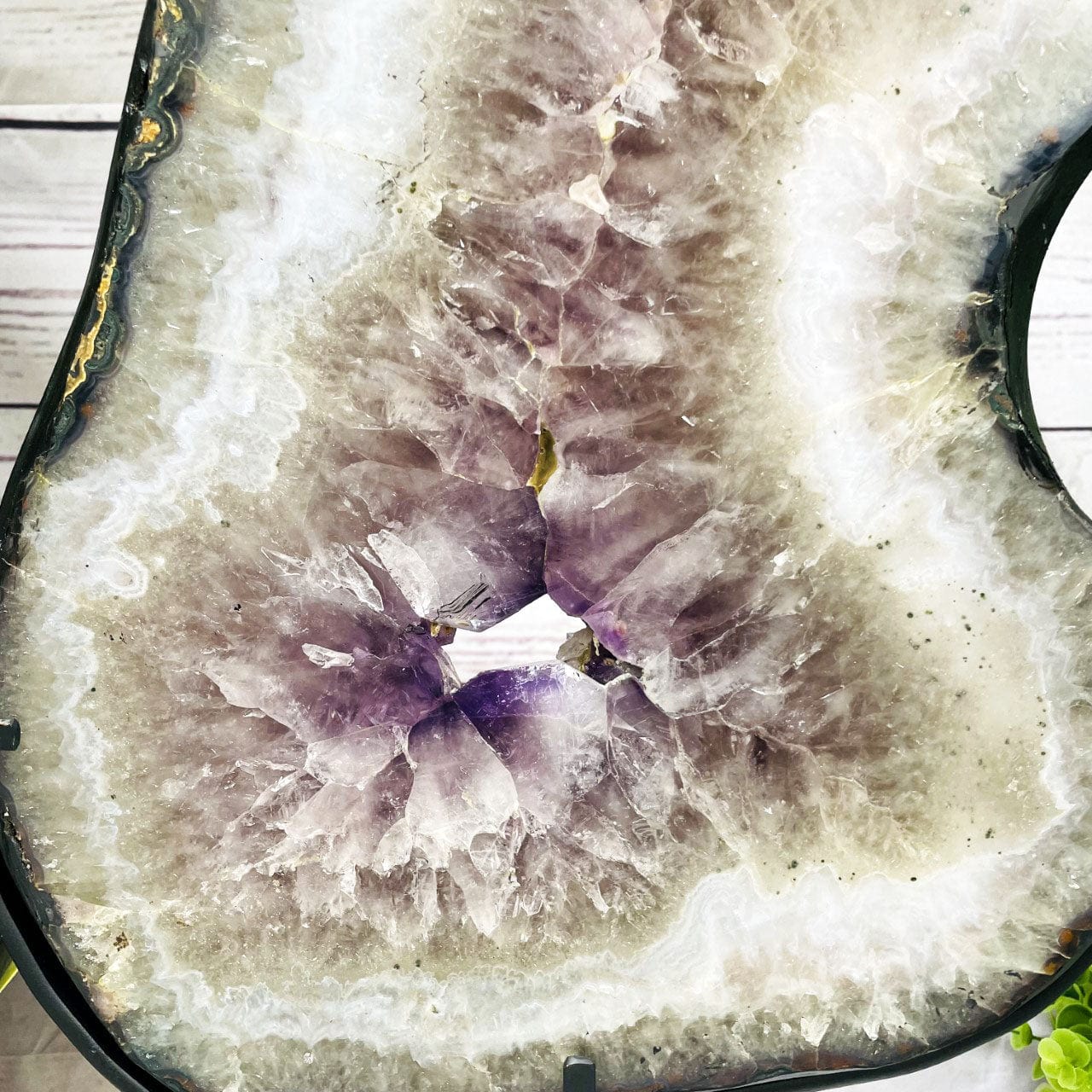 Amethyst Slice in shape of 8 on Metal Stand up close of crystals