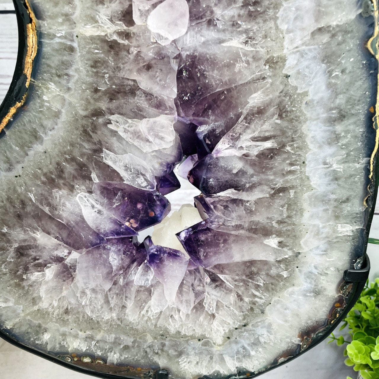 Amethyst Slice in shape of 8 on Metal Stand up close of crystals