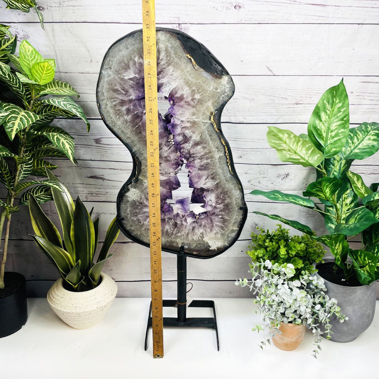 Amethyst Slice in shape of 8 on Metal Stand with a ruler