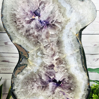 Amethyst Slice in shape of 8 on Metal Stand up close