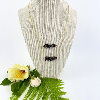 Garnet Stone Necklace on a bust showing gold and silver chain