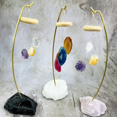 3 styles of the Crystal Eye Catchers style 1 Black Obsidian Base with Quartz, Citrine and Amethyst Polished Stones style 2 Crystal Quartz Base with Dyed Agate Slices of Assorted Colors style 3 Rose Quartz base with Crystal Quartz, Citrine, and Amethyst Raw Stone