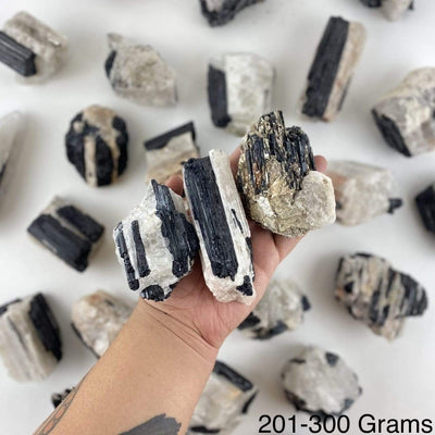black tourmaline on matrix displayed in hand size is for 201-300 grams