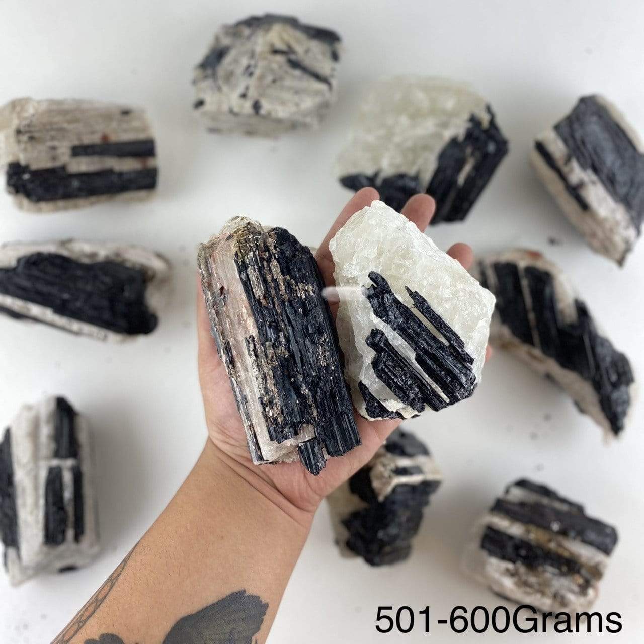 black tourmaline on matrix displayed in hand size is for 501-600 grams