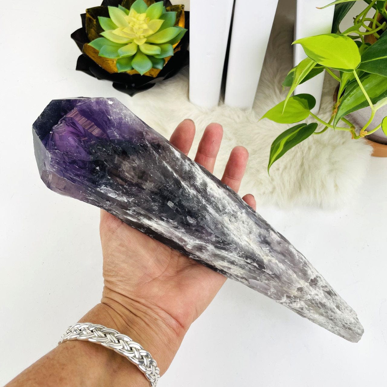 Large Elestial Amethyst Point in a hand for sizing