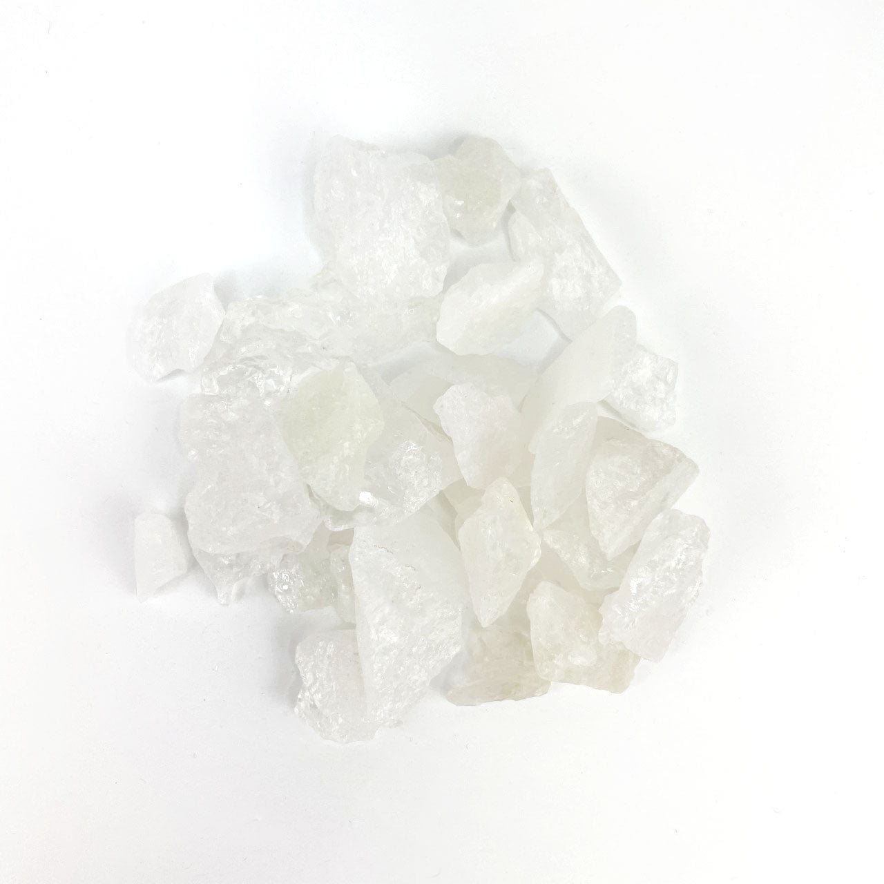 Crystal Quartz Stones in a pile on a table approximately 150 grams