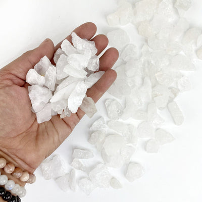 Crystal Quartz Stones in a hand for size