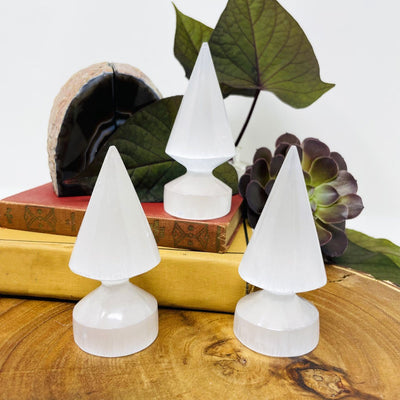 three selenite round spear tips on display for possible variations