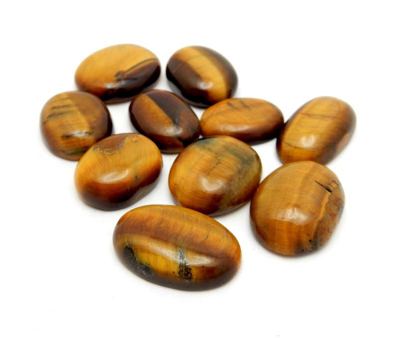 tigers eye cabochons on white background