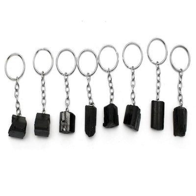 8 Tourmaline Stone Silver Toned Key Chains in a row on a table