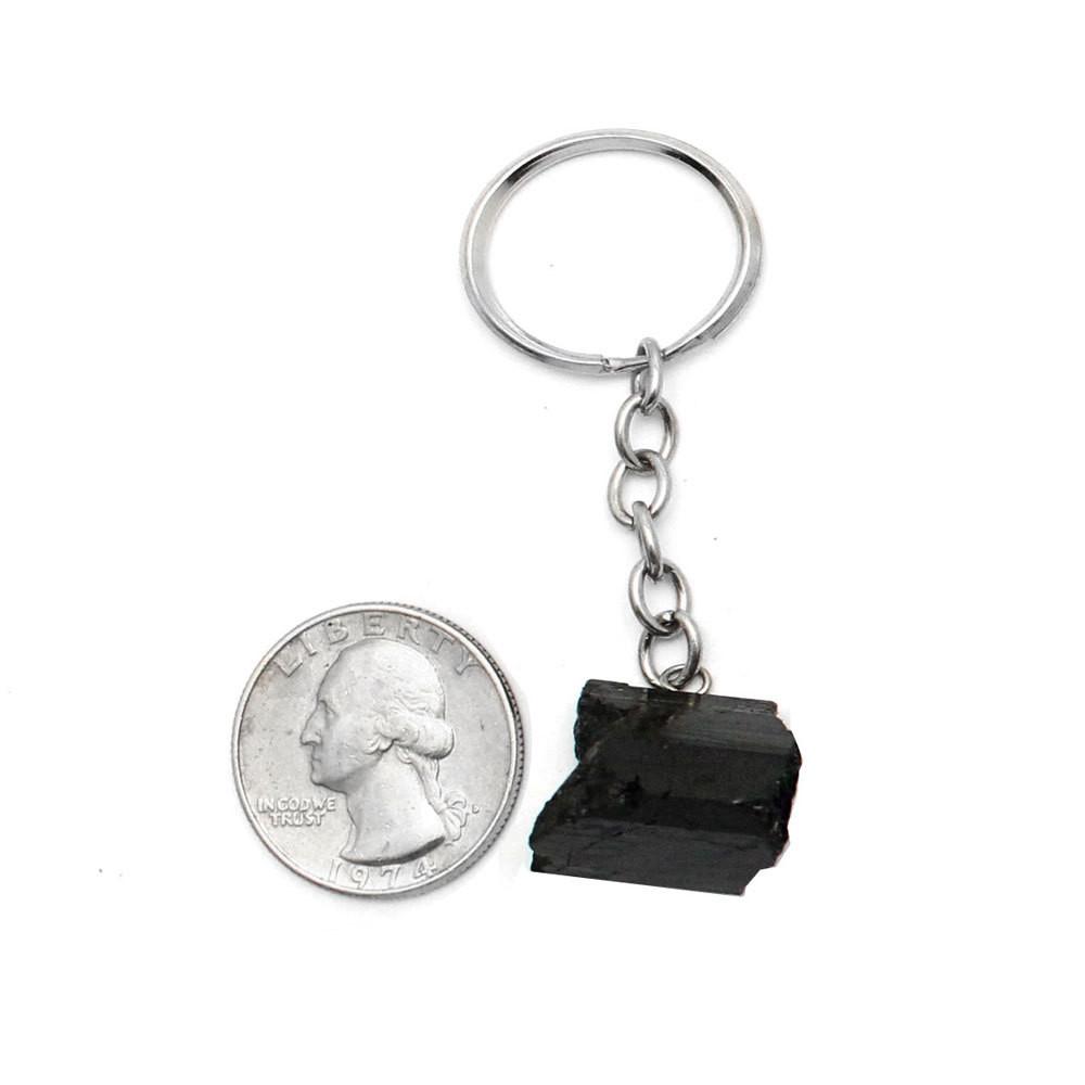 Tourmaline Stone Silver Toned Key Chain next to a quarter for size reference