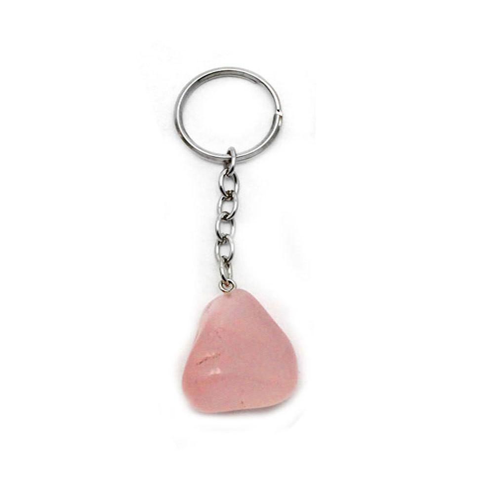 up close shot of tumbled rose quartz keychain on white background