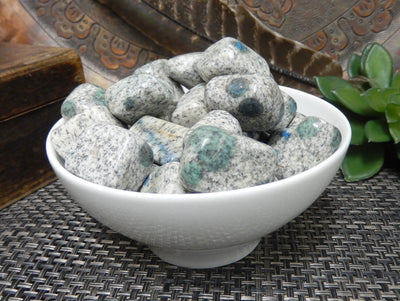 bowl filled with granite/jasper tumbled stones