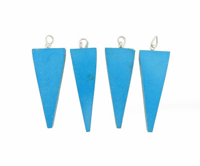  4 turquoise colored triangle with silver plated bail displayed to show various width options