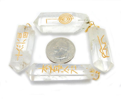 4 Piece Set Usui Reiki Crystal Quartz Point Pendant Set with Gold Tone Bail around a quarter for size reference 