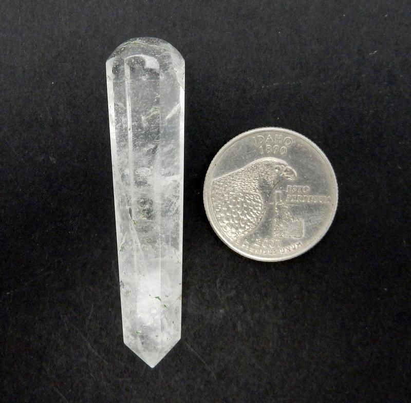 Crystal Quartz Massage Wand next to a quarter for size reference