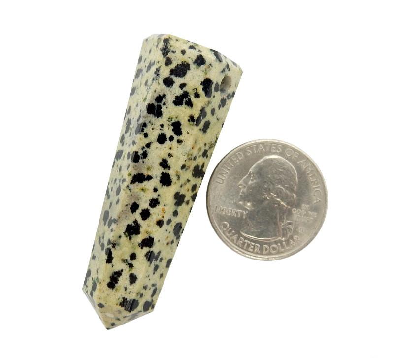 Dalmatian Jasper Tower Obelisk Point Top Side Drilled Next to a Quarter on White Background.