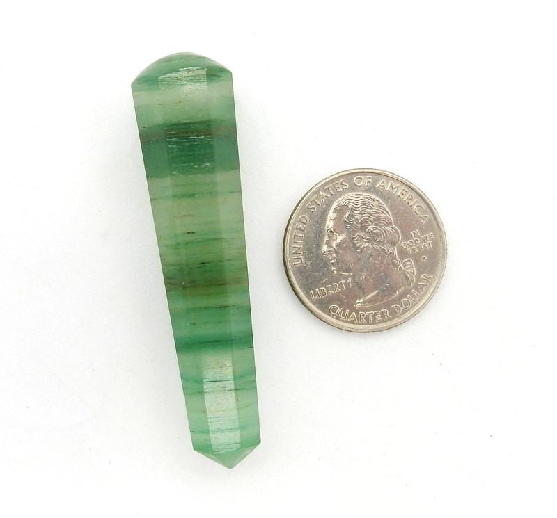 fluorite message wand next to a quarter for size reference 