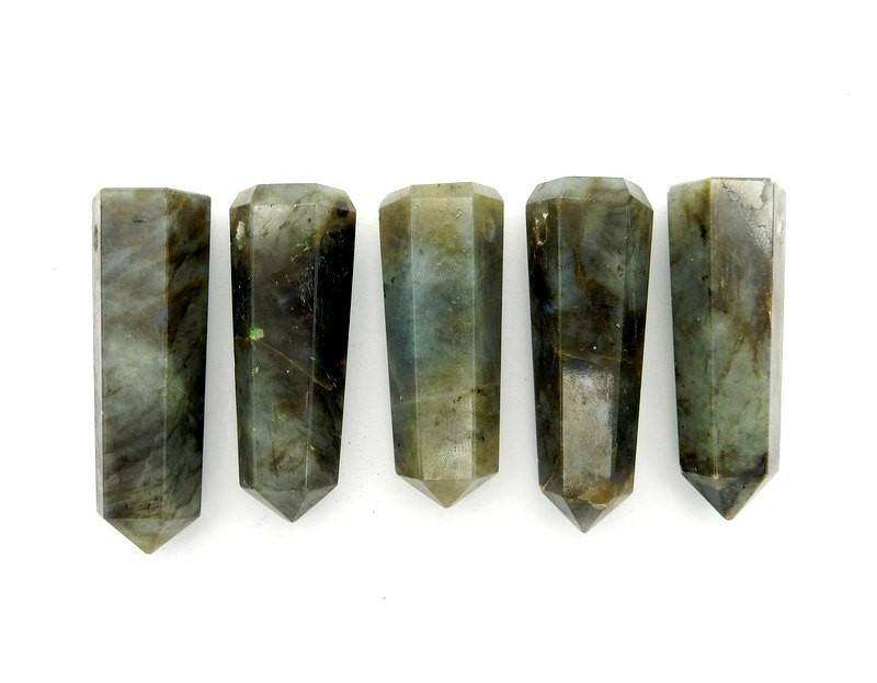multiple labradorite top drilled points displayed to show the slight differences in the sizes 