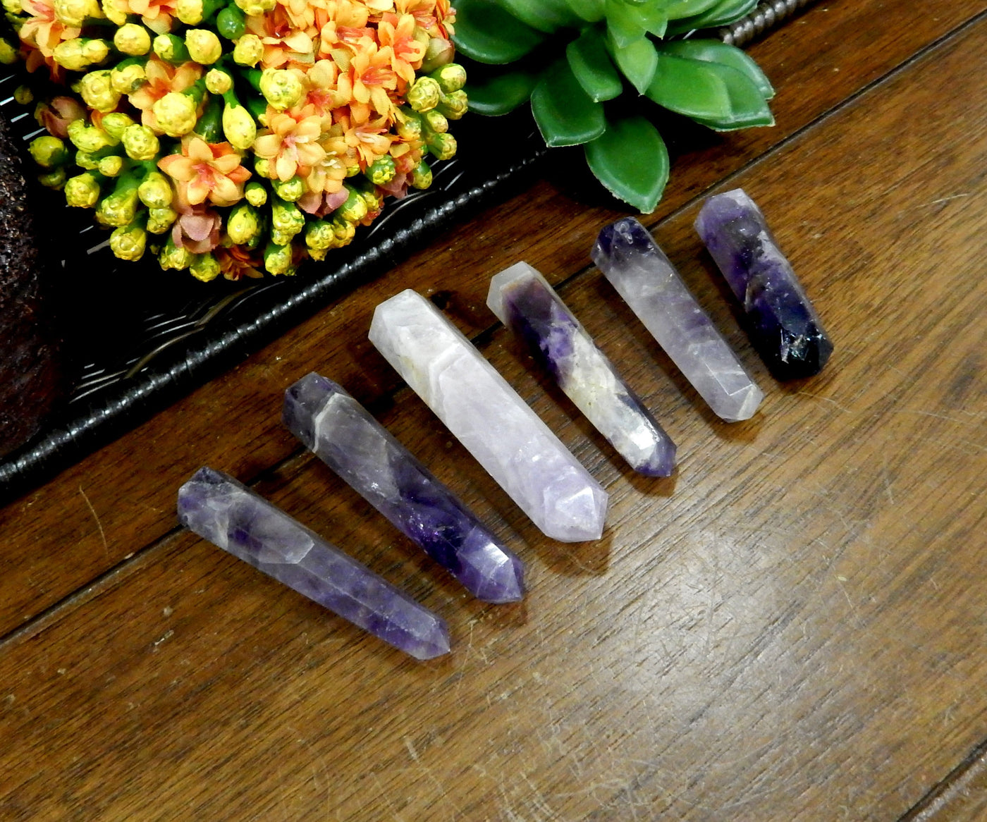 multiple amethyst points displayed to show the differences in the sizes and color shades