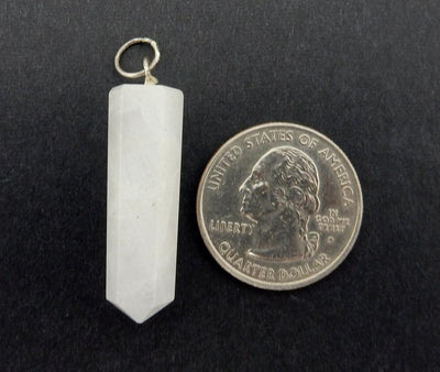 White Agate Point Pendant With Silver Tone Bail  - one next to a quarter