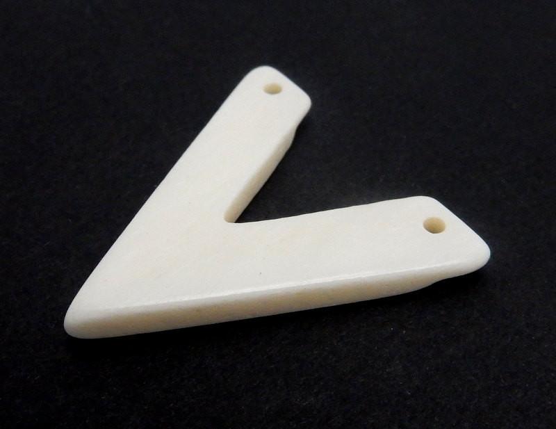 side view of a White Bone V Top Corner Drilled Bead with blank background