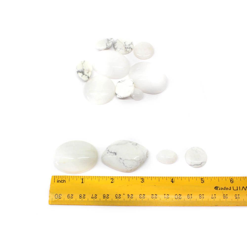 White Howlite Cabochon displayed with ruler to show the various sizes the shapes come in
