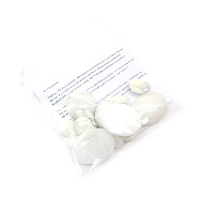 1/4 Lb Bag Mixed Shapes of white Howlite cabochons displayed in a bag 