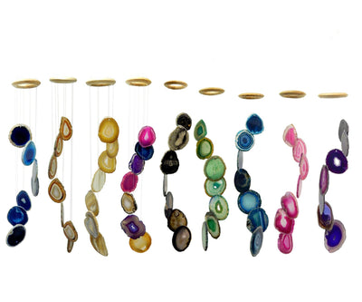 This Picture is showing all of our agate slice windchimes we have available, on our website. Displayed on a white background. 