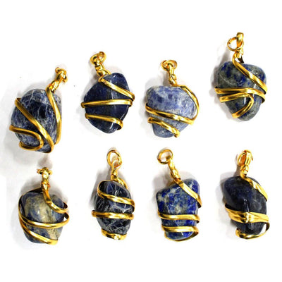 8 gold wire wrapped sodalite pendants on white background