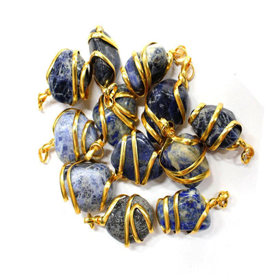 gold wire wrapped sodalite pendants on white background