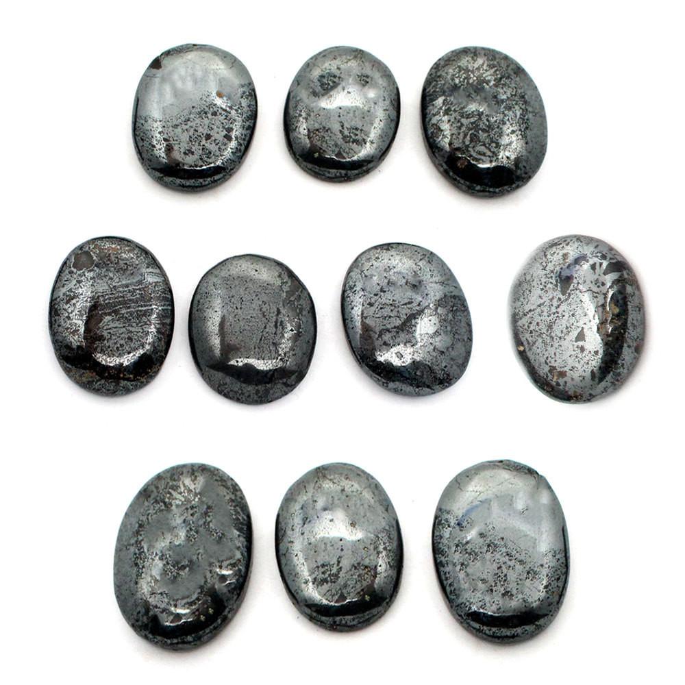 multiple Hematite Worry Stone Slabs displayed on white background to show various textures natural inclusions shape and shades of gray  