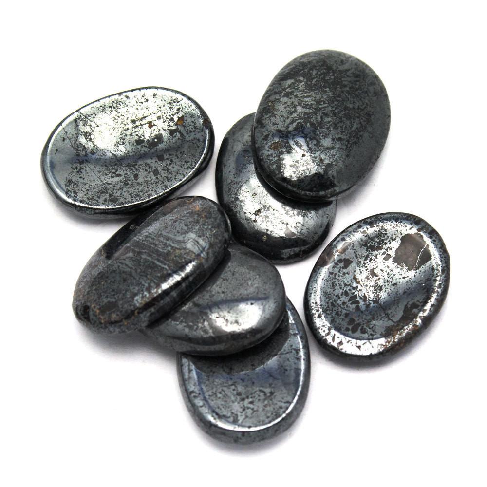 multiple Hematite Worry Stone Slabs displayed to show back and front sides of thumb stone and for thickness reference