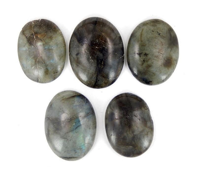 multiple thumb stones displayed to show various color natural inclusions and over all appearance per stone
