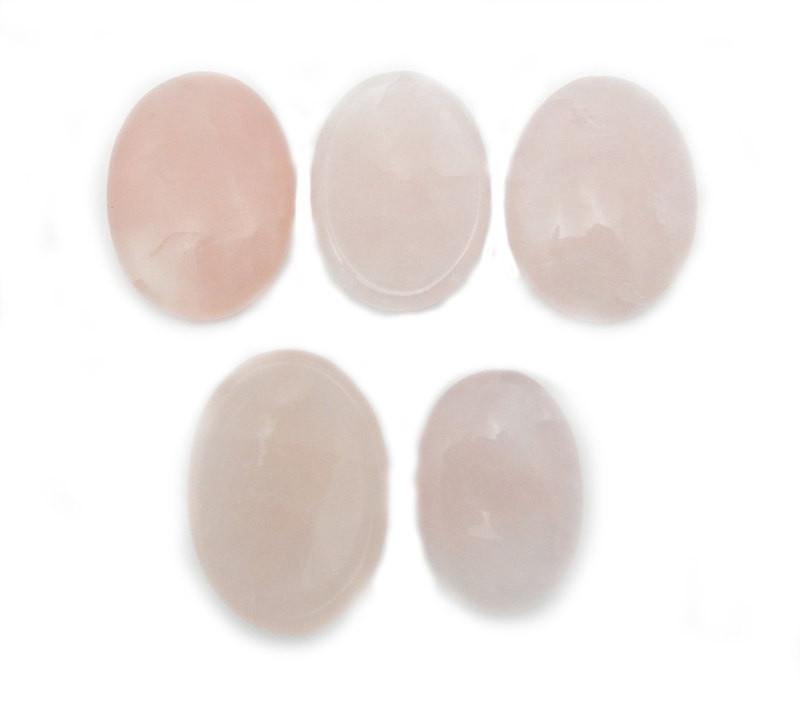 5 Rose Quartz Worry Stone Slabs lined up on white backgorund