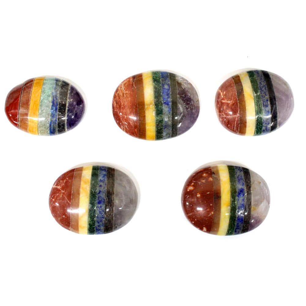 five seven chakra worry stones on white background for possible variations