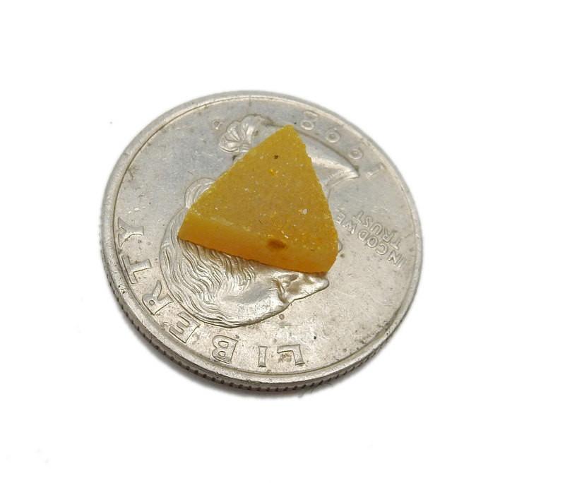 Yellow triangle Druzy stone on quarter for size reference